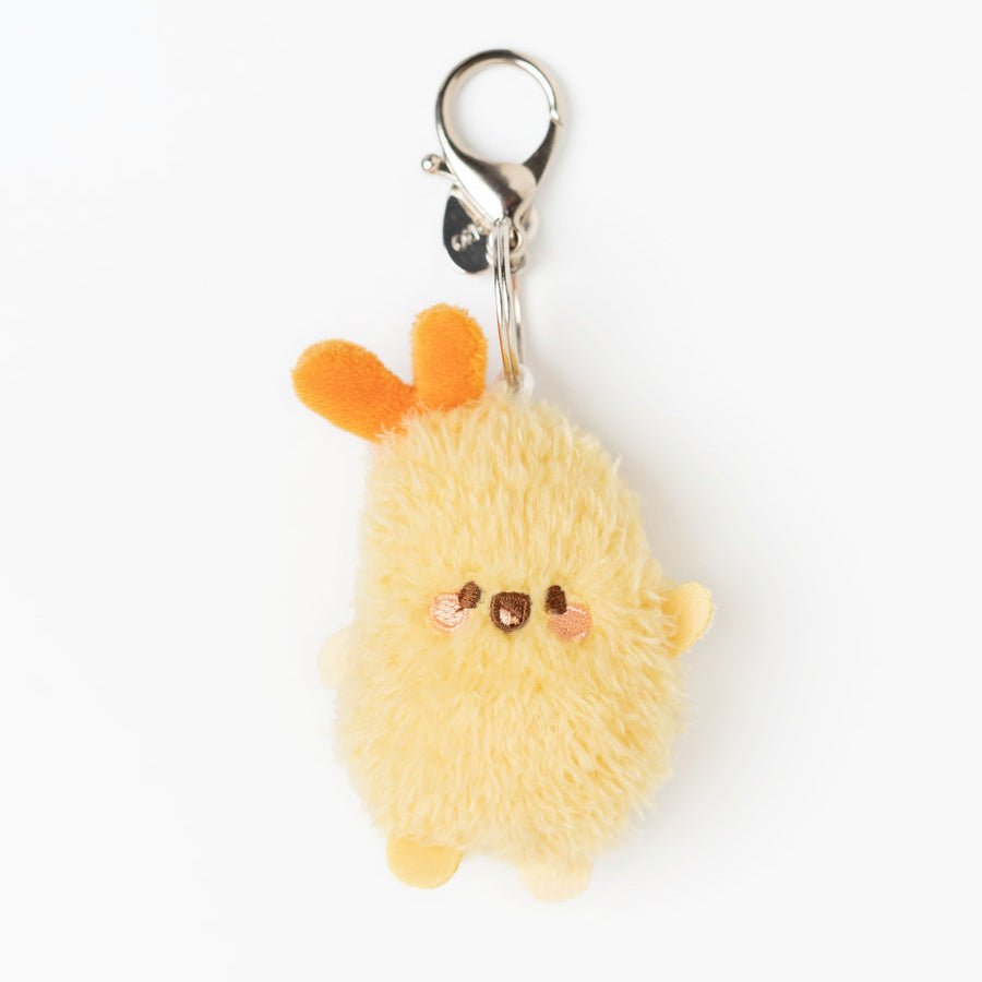 A small fluffy yellow plush keychain charm with orange ears and a silver lobster clasp, shown on a plain white background.