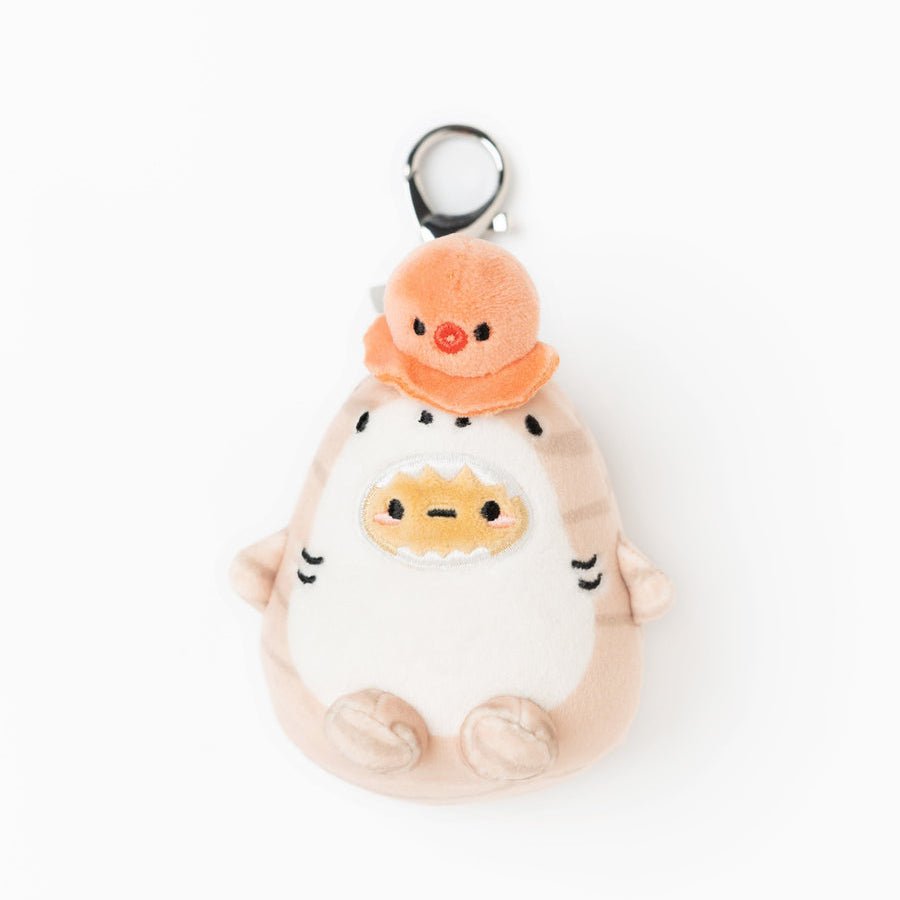Plush toy with a small orange character on a white background
