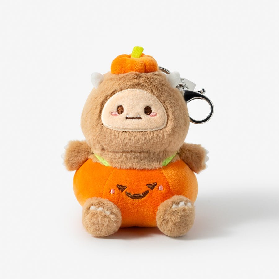 Plush keychain with a cute face design on a white background
