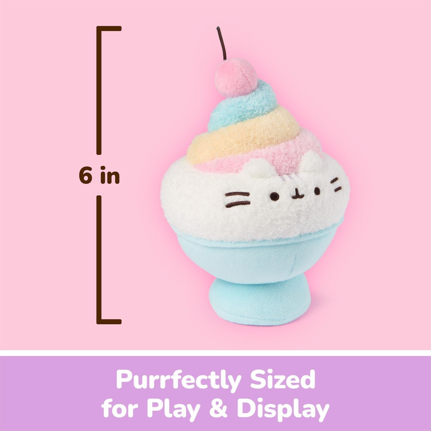 A pastel plush toy shaped like a dessert cup with a cat face, shown on a pink background with a height marker reading 6 in and text at the bottom that says 'Purrfectly Sized for Play & Display'.