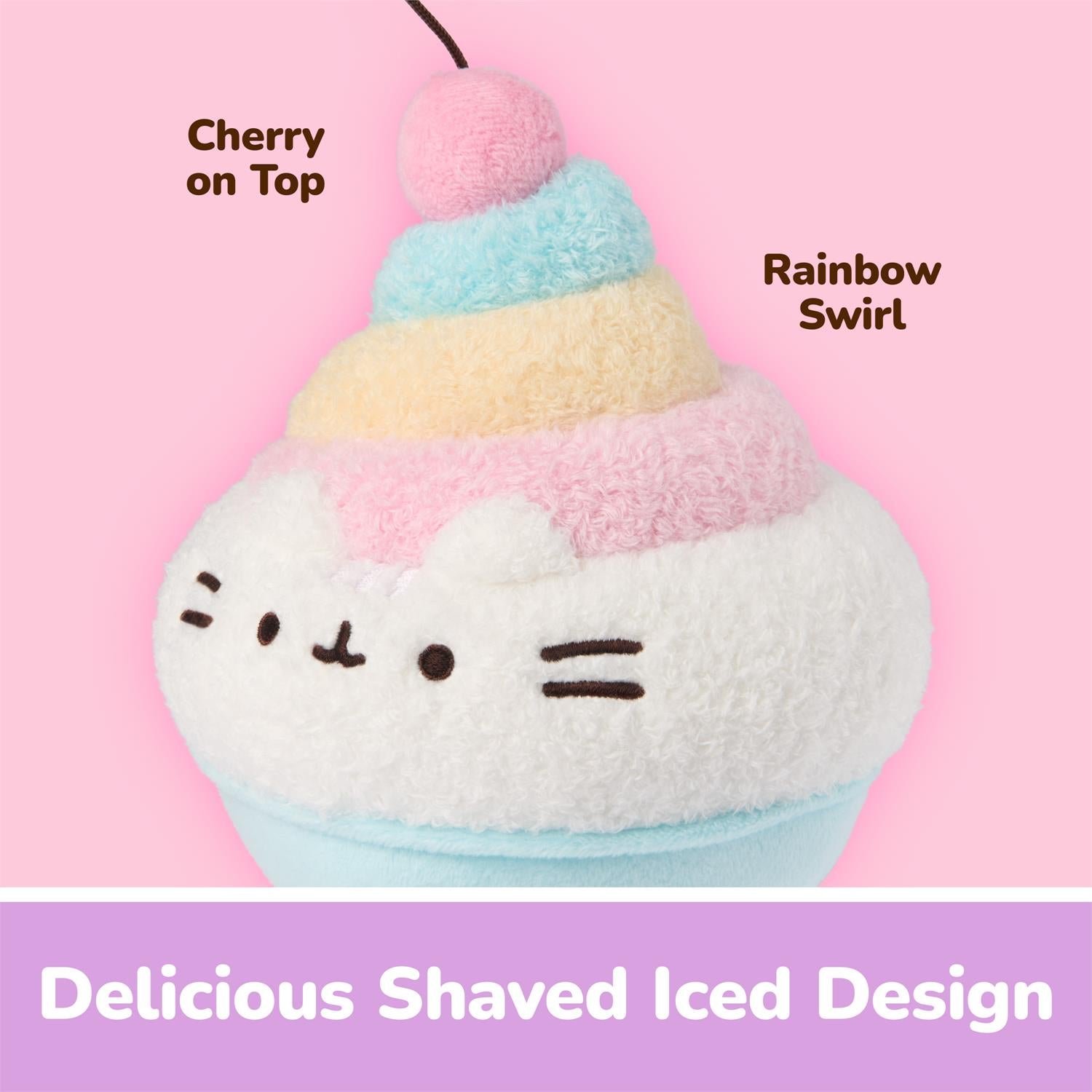 A plush cupcake character toy with a white fuzzy body, pastel pink, yellow, and blue frosting-like layers, a cherry on top, and text labels reading 'Cherry on Top,' 'Rainbow Swirl,' and 'Delicious Shaved Iced Design' on a pink background.