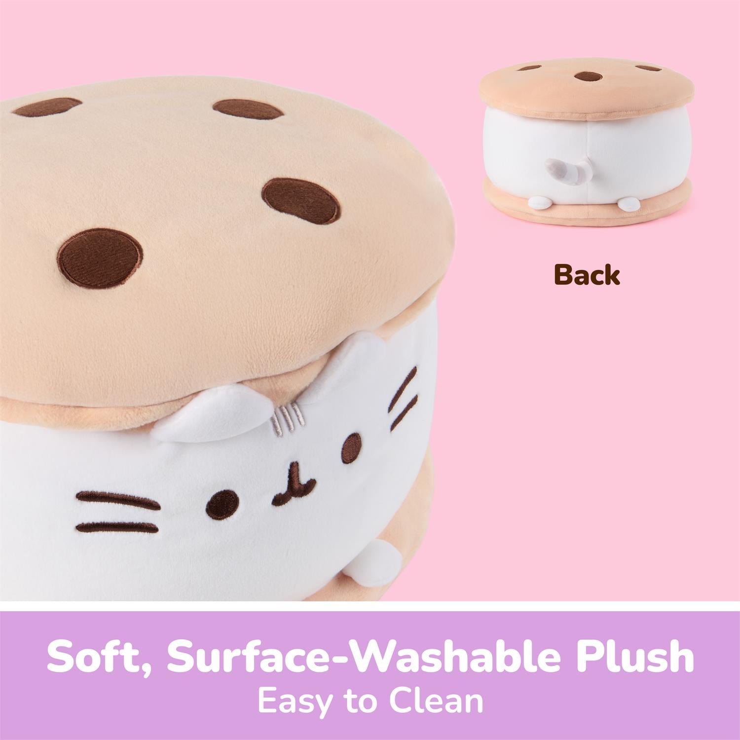 A plush cat-shaped stool designed to look like a cookie, with a tan top, dark brown spots, and a white cat face on the side. A smaller inset shows the back view.