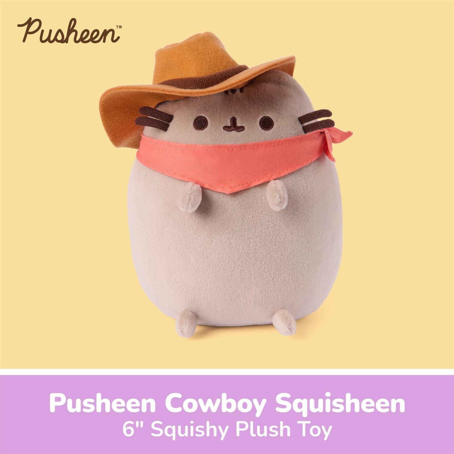 A Pusheen plush toy dressed as a cowboy, featuring a brown hat, coral bandana, and gray body, shown on a pale yellow background with a purple text banner at the bottom reading 'Pusheen Cowboy Squisheen 6" Squishy Plush Toy'.