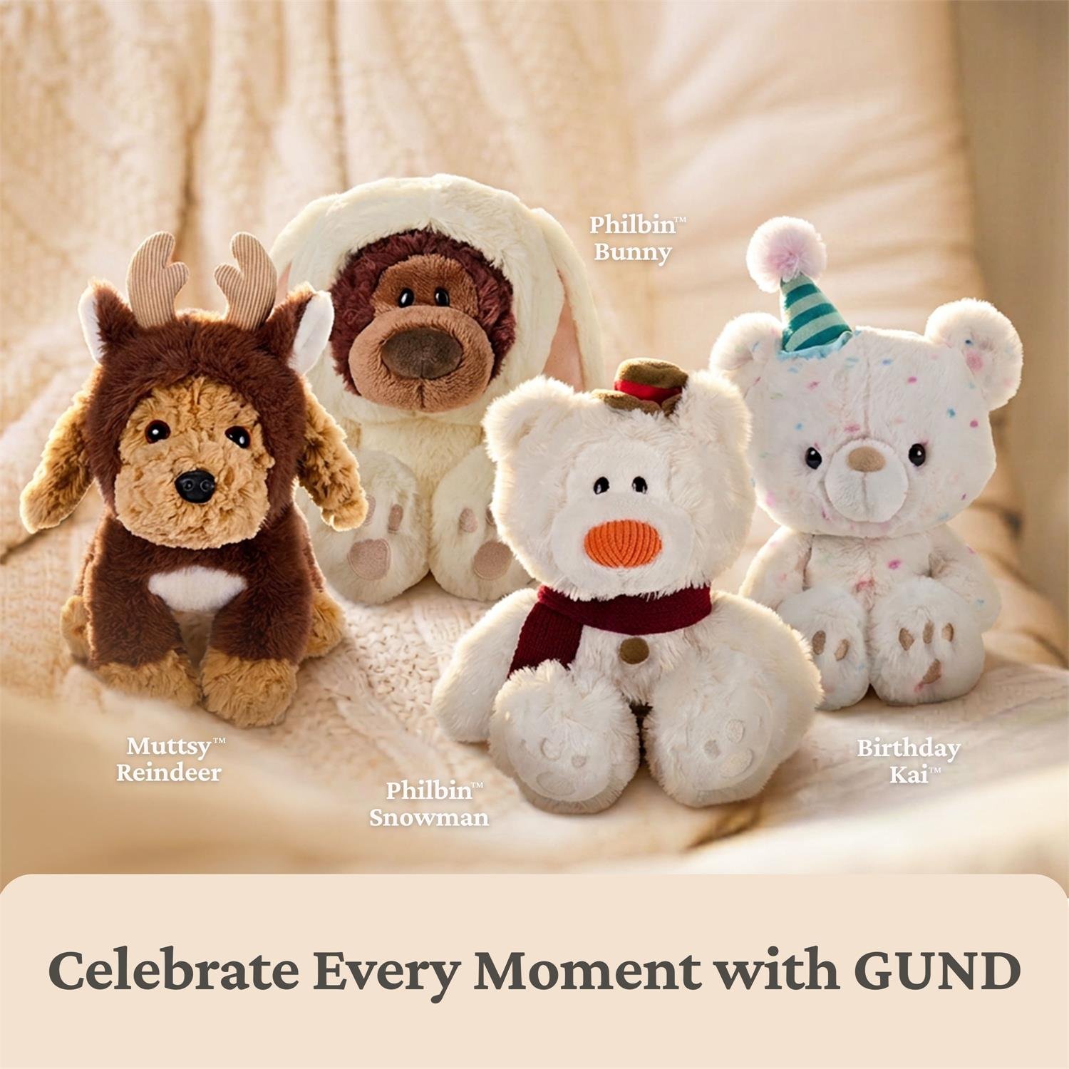 Four plush stuffed animals arranged together on a soft beige fabric background: a brown reindeer, a white bunny in a hood, a white snowman with an orange nose and red scarf, and a white bear wearing a party hat. Text labels identify each plush, and a banner at the bottom reads 'Celebrate Every Moment with GUND'.