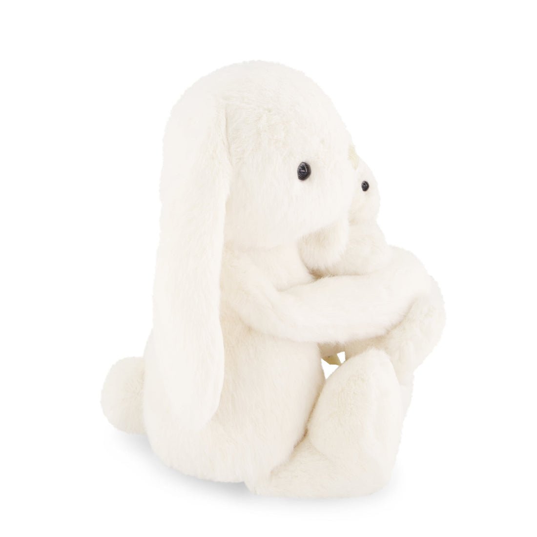 White plush toy sitting on a white background